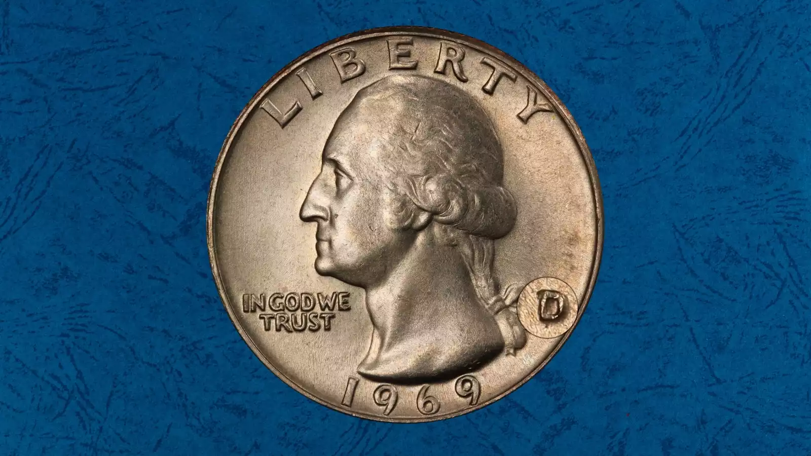 Close-up of 1969-D quarter showing Repunched Mint Mark (RPM) with secondary D impression offset from primary mint mark
